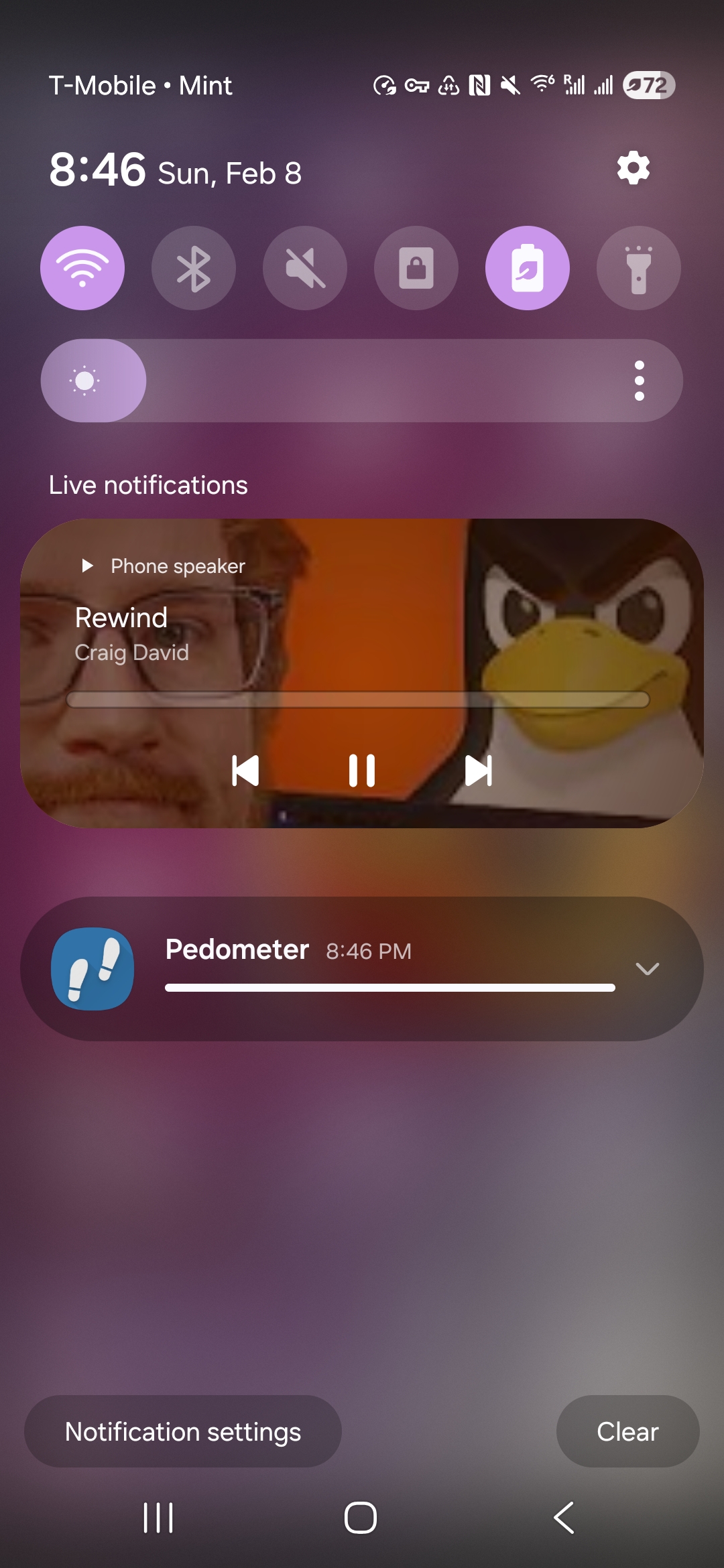 Screenshot of my phone's notification shade. It shows a notification to control media. The media is Rewind by Craig David, but the album art that KDE connect has picked to represent the song is a random youtube thumbnail with Tux the linux penguin and some white guy on it.