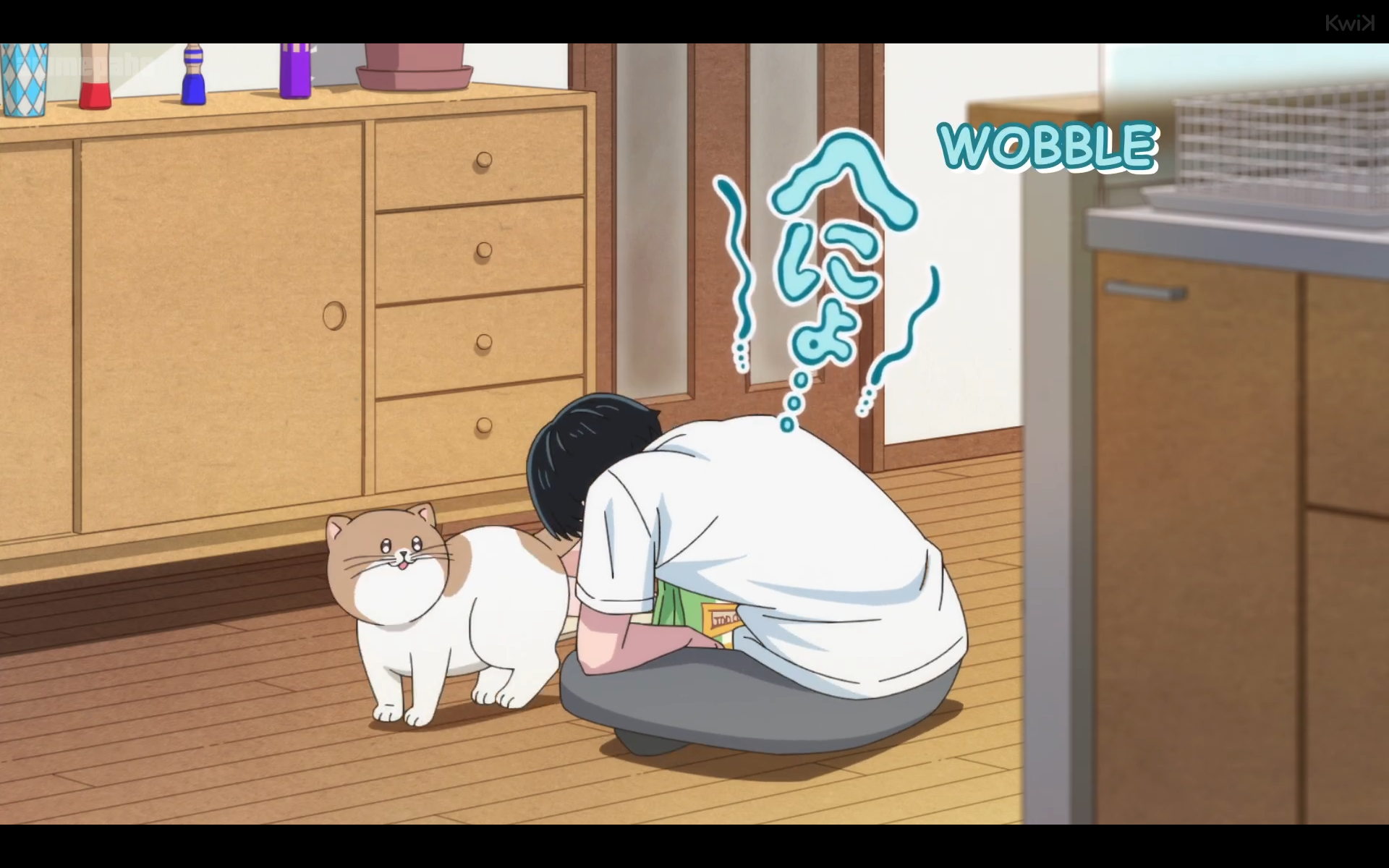 same anime. now the cat is looking cutely at the boy as he sits on the floor, looking defeated