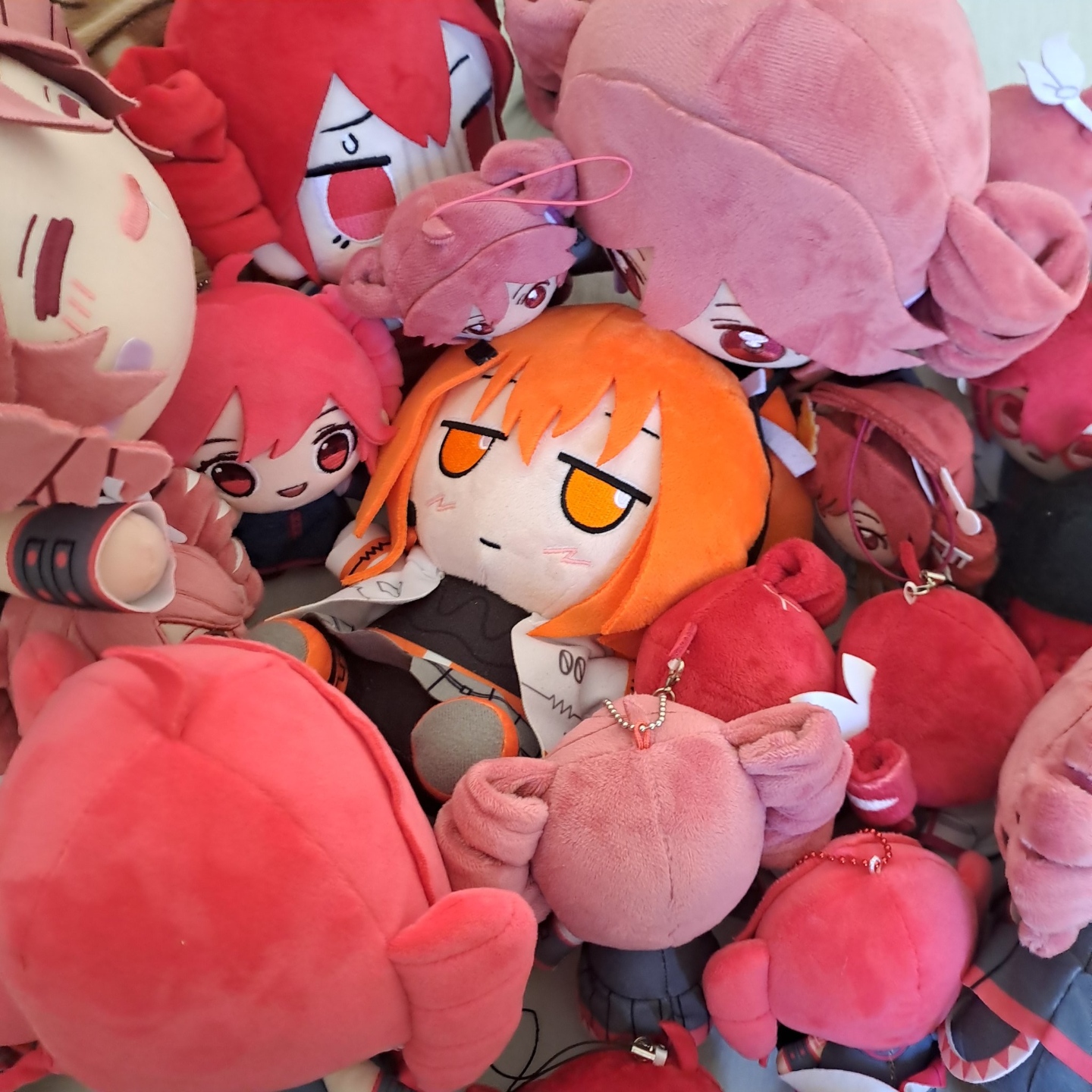 An Adachi Rei fumo plushie surrounded by different types of Teto plushies.

Photo by @linzy93211 on Twitter.